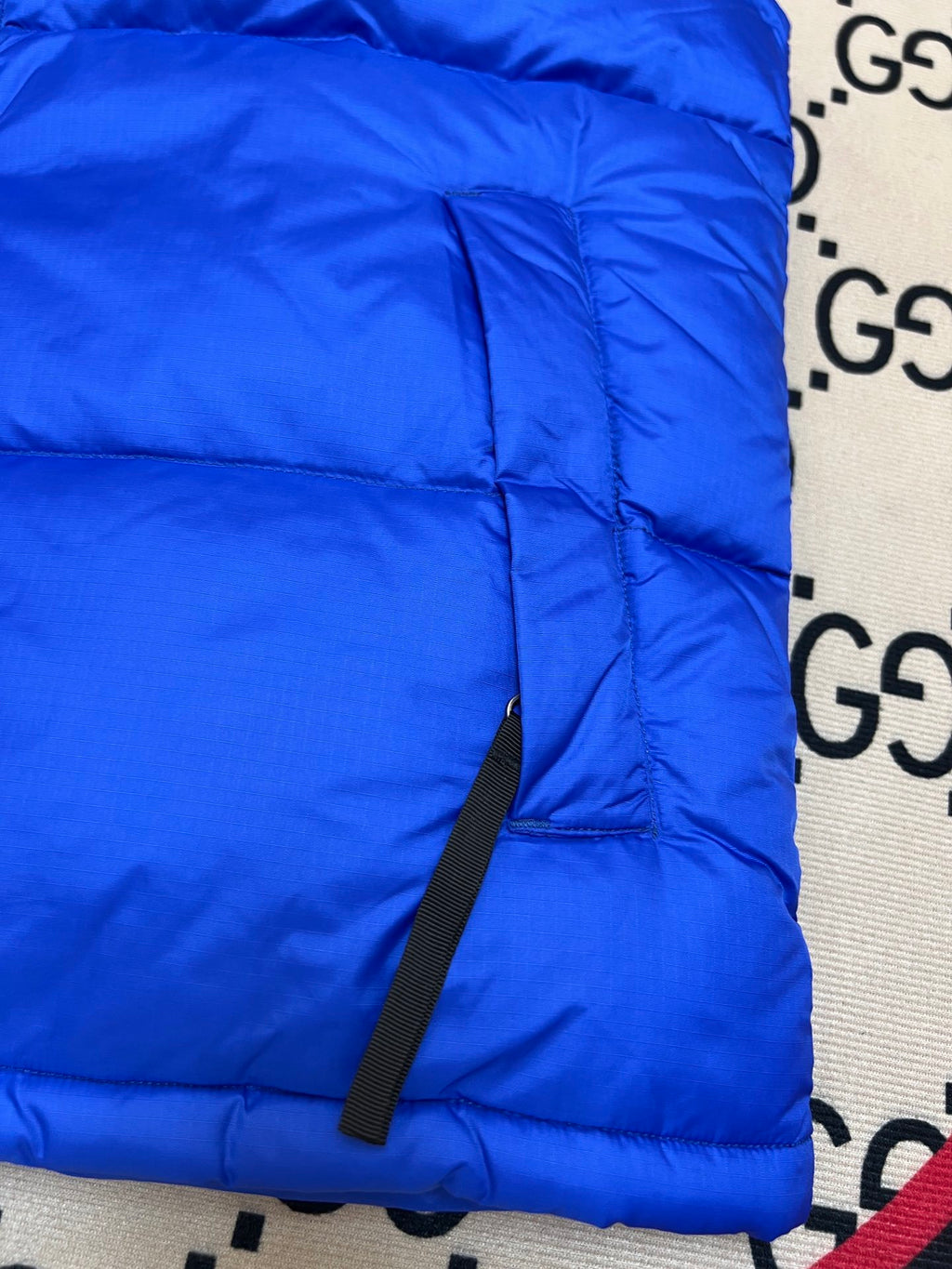 The North Face Puffer Vest in Royal Blue and Black with Stand Collar