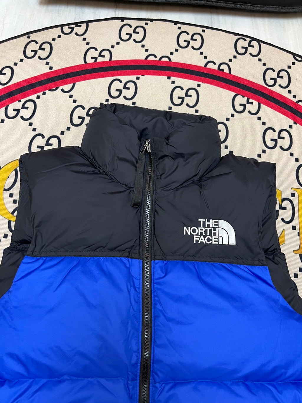 The North Face Puffer Vest in Royal Blue and Black with Stand Collar