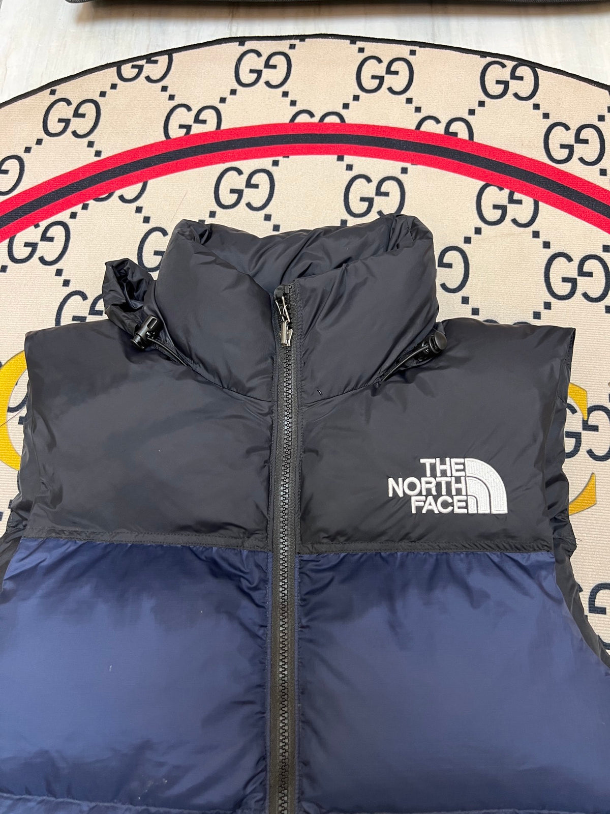 The North Face Puffer Vest in Navy and Black with Stand Collar
