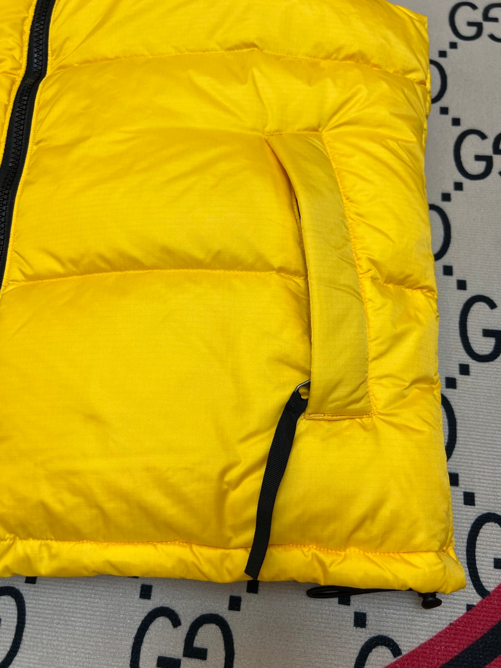 The North Face Puffer Vest in Yellow and Black with Stand Collar