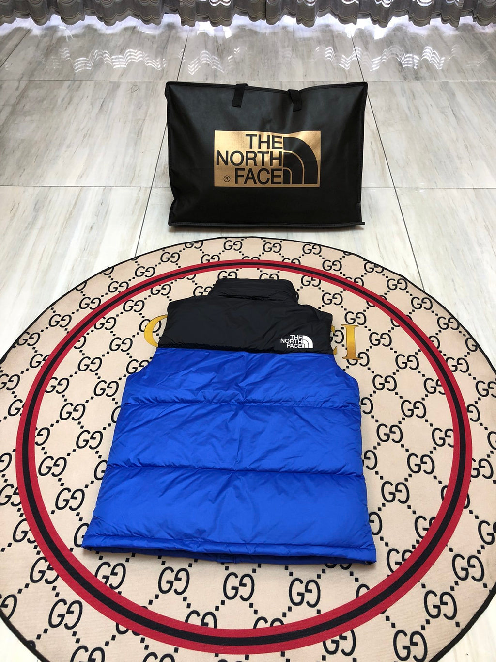 The North Face Puffer Vest in Royal Blue and Black with Stand Collar