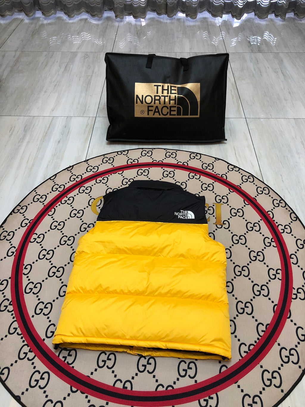 The North Face Puffer Vest in Yellow and Black with Stand Collar