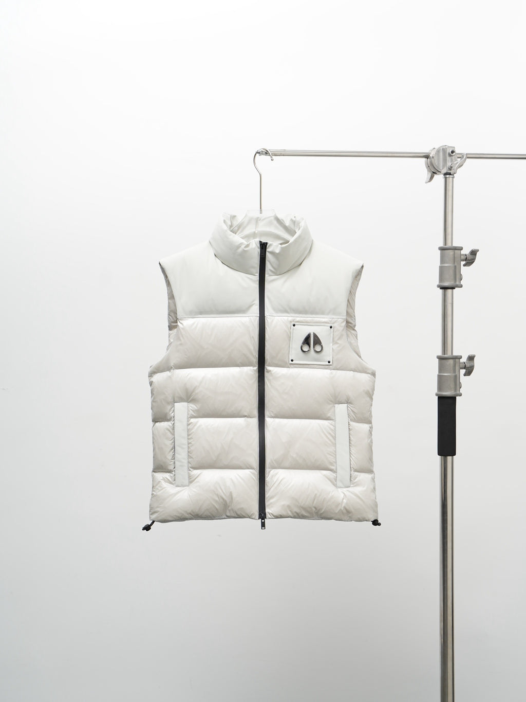 Moose Knuckles Puffer Vest in White with Stand Collar and Metallic Logo