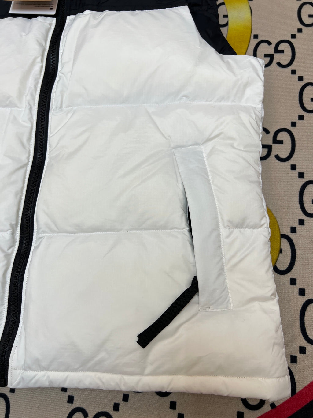 The North Face Puffer Vest in White and Black with Stand Collar