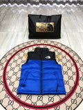 The North Face Puffer Vest in Royal Blue and Black with Stand Collar