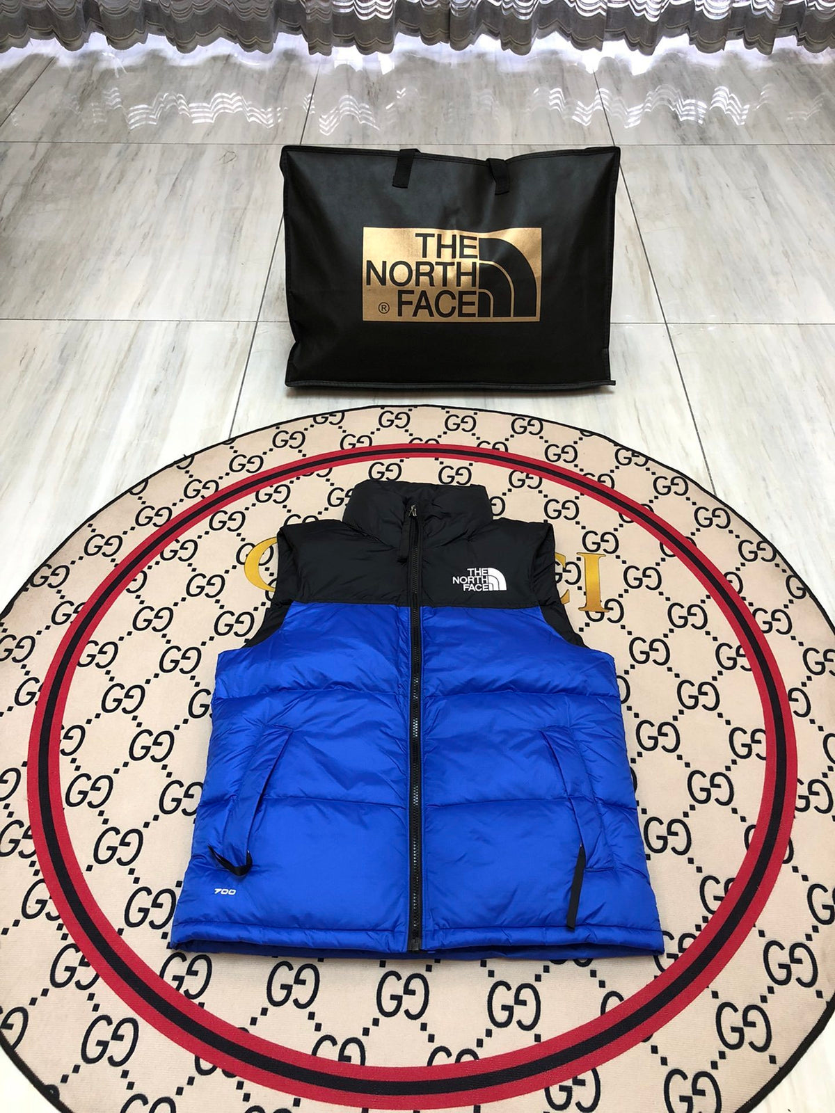 The North Face Puffer Vest in Royal Blue and Black with Stand Collar