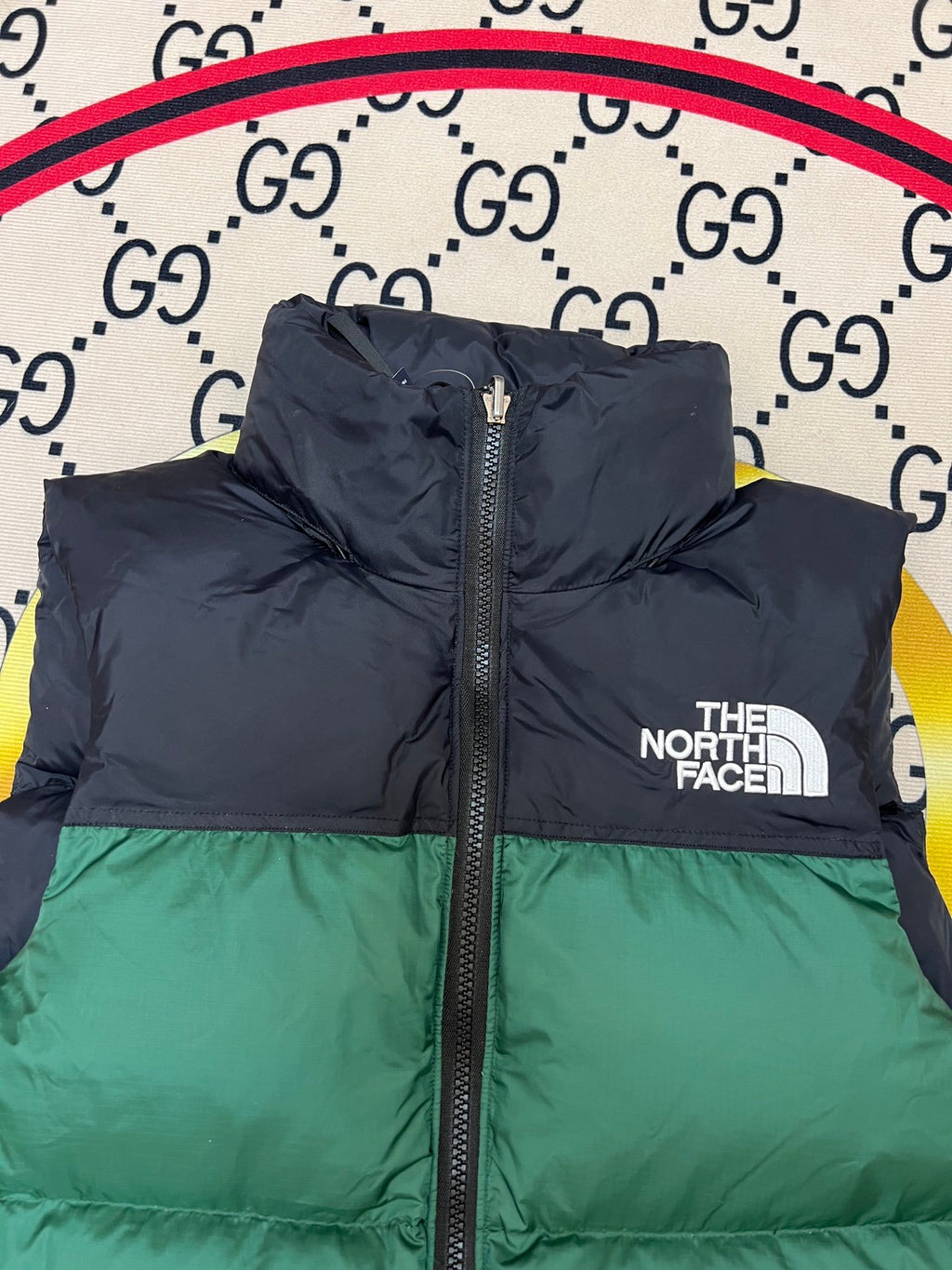The North Face Puffer Vest in Green and Black with Stand Collar