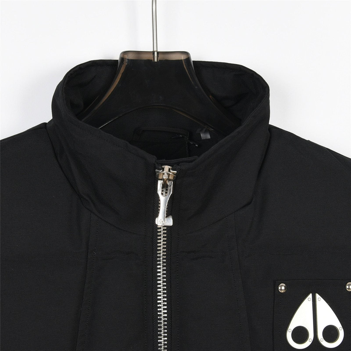 Moose Knuckles Puffer Vest in Black with Metallic Logo and Stud Details