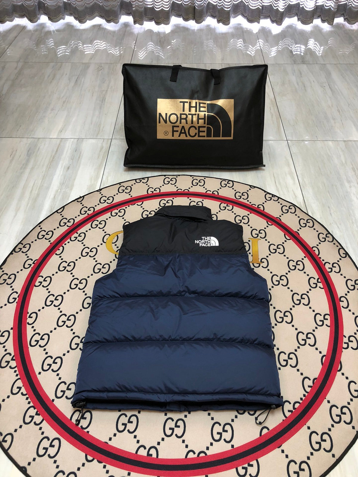 The North Face Puffer Vest in Navy and Black with Stand Collar