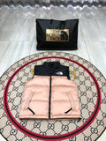 The North Face Puffer Vest in Blush Pink and Black with Stand Collar
