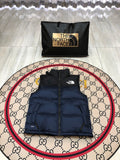 The North Face Puffer Vest in Navy and Black with Stand Collar